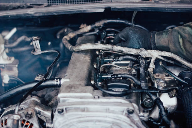 Close-up of car engine components and wiring