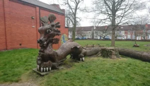 Dragon sculpture in Willenhall park, highlighting FM Auto Remapping’s local services.