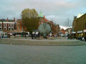 View of Walsall town centre with iconic artwork, highlighting FM Auto Remapping services in the area.