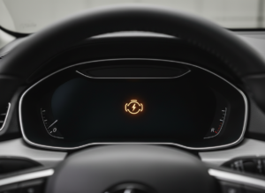 Engine management warning light illuminated on a vehicle dashboard